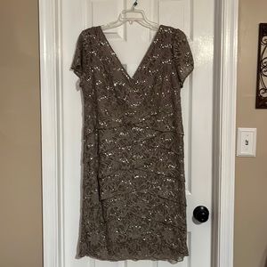 Taupe mother of the bride dress. Cocktail length. Very flattering.
